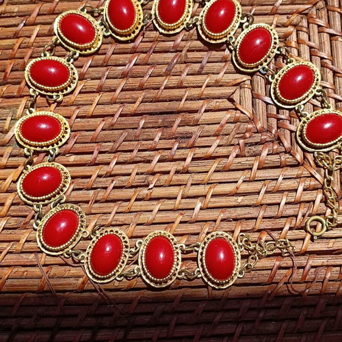 Vintage necklace used with red stones and brass metal
