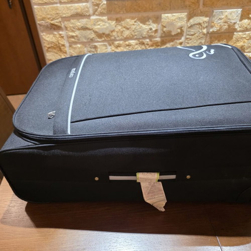 Carpisa 28" Travel Suitcase used, black semi-rigid fabric