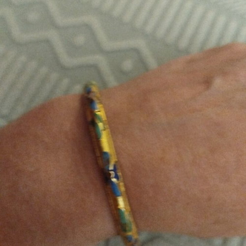 Metal bracelet with unique colorful designs like new