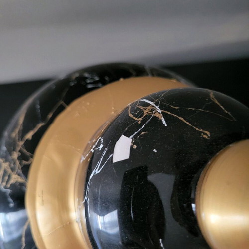 Decorative vase used with lid, black marble look and gold details