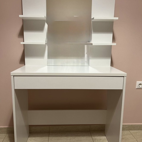 White makeup vanity table with drawer and shelves