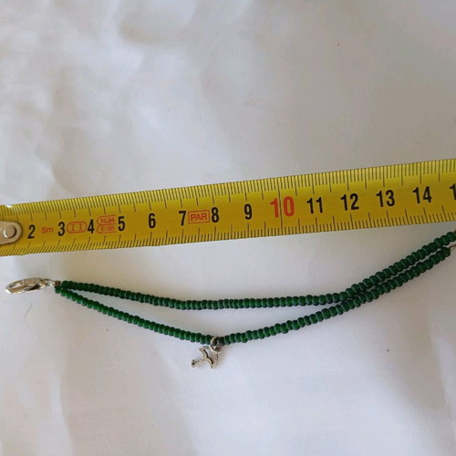 Handmade bracelet with green beads and silver umbrella charm