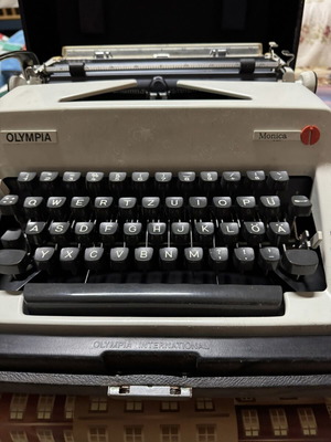 Olympia Monica portable mechanical typewriter used with case