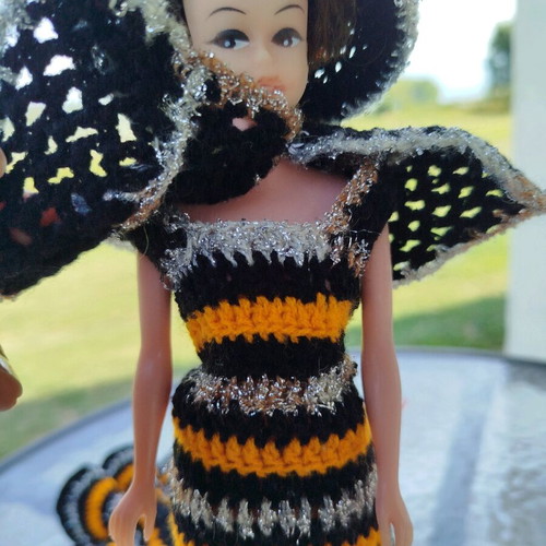 70s doll with handmade knitted clothes and metal stand