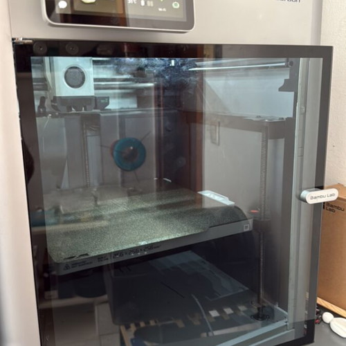 Bambu Lab X1C 3D printer with complete hotends and PEI texture plate