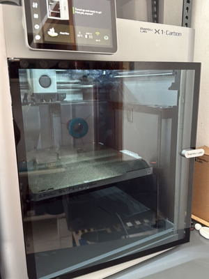 Bambu Lab X1C 3D printer with complete hotends and PEI texture plate