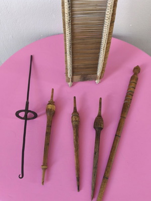 Traditional loom set used with wooden spindles and metal distaff