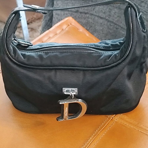 Dior small black hand bag like new with silver details