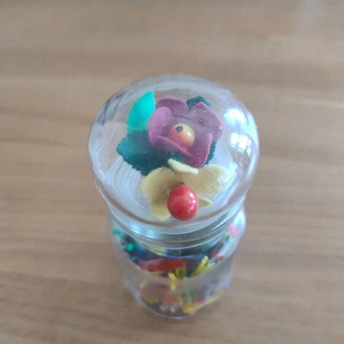 Storage jar with small clothespins for crafts