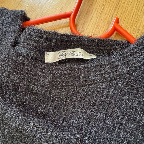 Knitted blouse like new with metallic thread and lace sleeves black