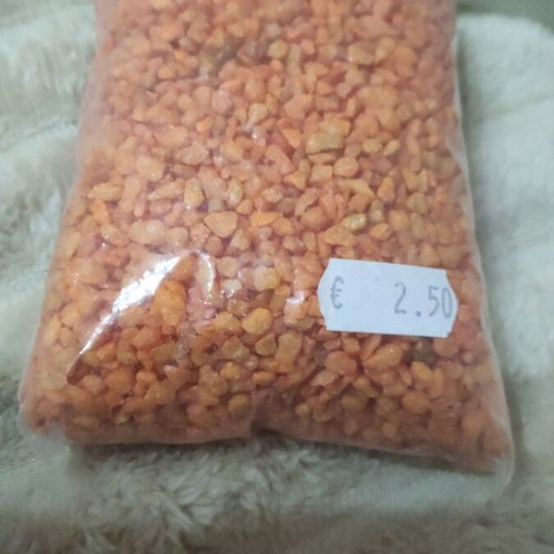 Plastic aquarium used with orange and blue gravel and accessories
