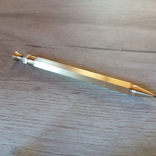 Hexagonal brass pen used, with g2 refill included