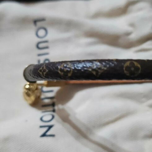 Louis Vuitton leather bracelet with gold plated backpack charm
