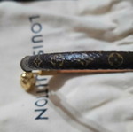 Louis Vuitton leather bracelet with gold plated backpack charm