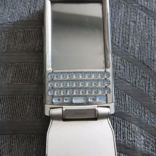 Sony Ericsson P 990i vintage mobile phone used with dock and charger