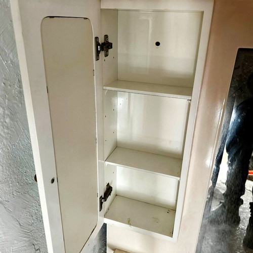 Bathroom cabinet with mirror hanging used