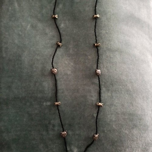 Long necklace with cat faces and paw charms like new