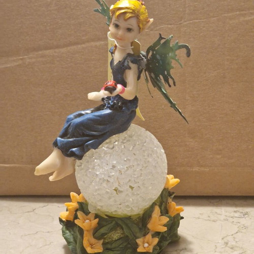 Decorative fairy on ball like new