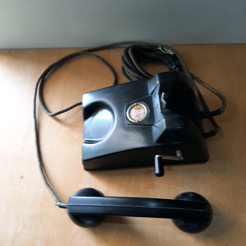 Antique telephone with crank used, 1920-30