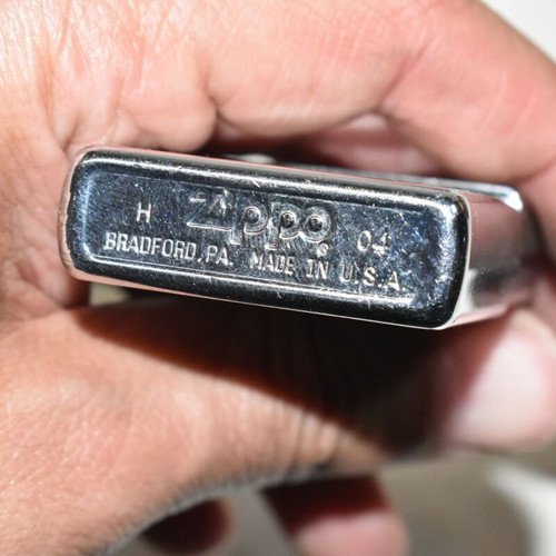 Zippo chrome lighter with sailboat design used
