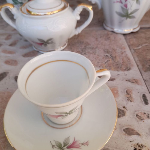 Porcelain tea set collectible with gold details and small vases like new