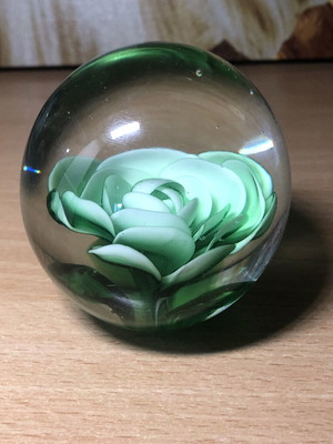 Vintage paperweight with light green flower