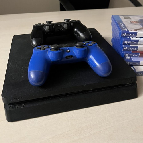 PS4 Slim 500GB console with 2 controllers and 6 games