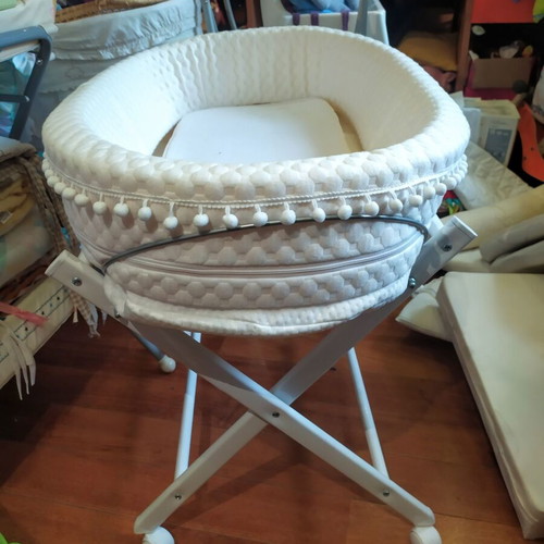 Bassinet on wooden base with wheels like new