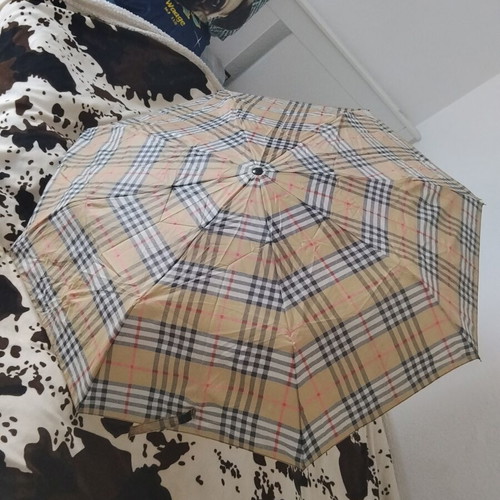 Vintage unisex folding umbrella with wooden handle, used