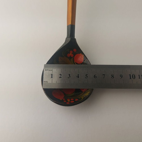 Old painted wooden spoon used