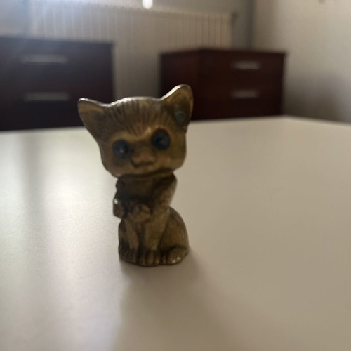Vintage brass cat figurine with blue glass eyes like new