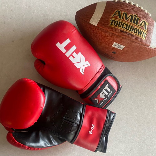 Boxing gloves and rugby ball like new