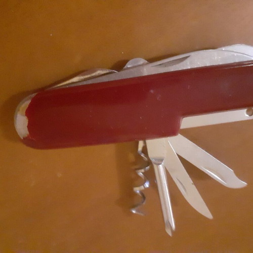 Two multitool pocket knives new with scissors and serrated blade
