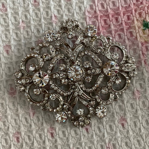 Silver brooch with stones