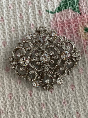 Silver brooch with stones