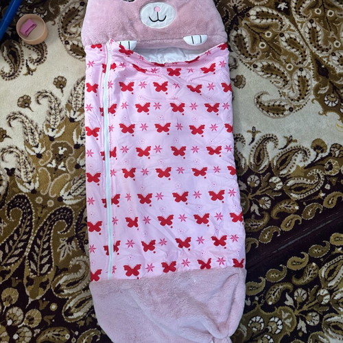 Sleeping bag used, foldable with one button missing