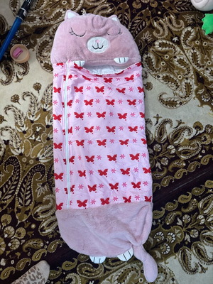 Sleeping bag used, foldable with one button missing