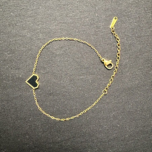 Women's bracelet new in gold tone with black heart