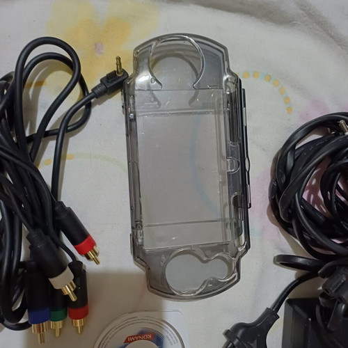 Sony PSP handheld consoles with accessories and games