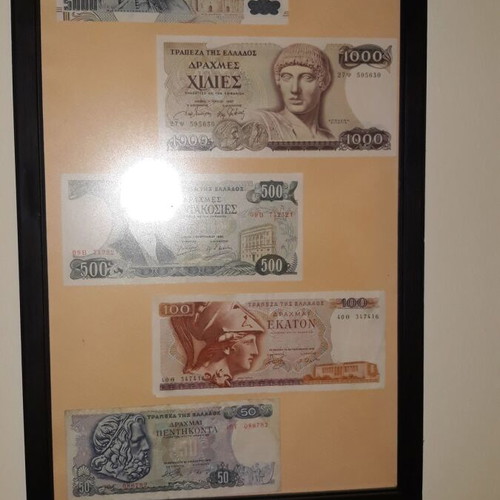 Collection of authentic Greek banknotes in frame with matte glass