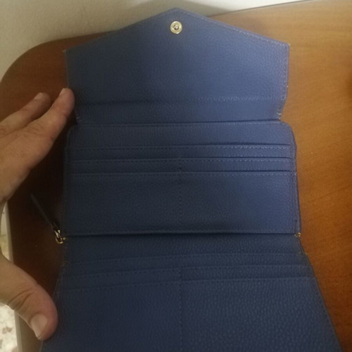 KEM wallet used, blue with multiple compartments