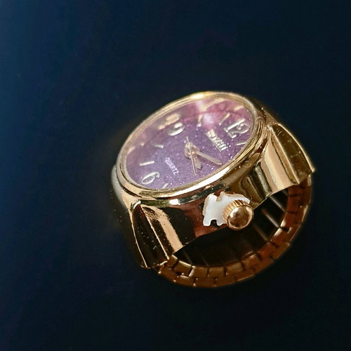 Quartz ring watch like new with purple dial and gold bracelet