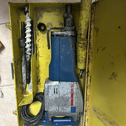 Bosch floor jackhammer used with accessories and metal case