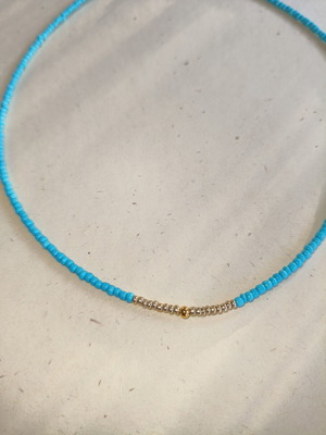 Handmade necklace with gold and blue beads