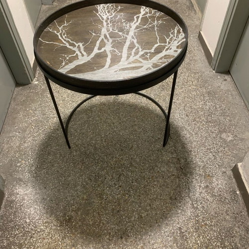 Decorative coffee table used with metal base and wooden top frame