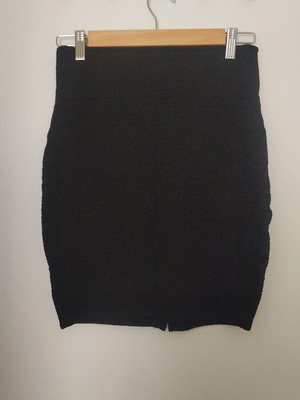 Embossed black elastic skirt used with small slit at back