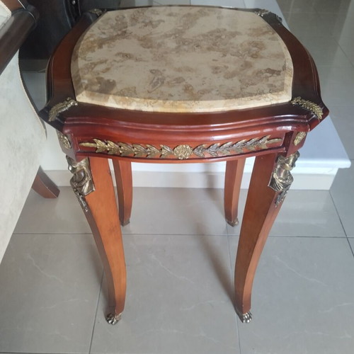 Antique table with marble top and bronze caryatids