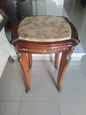 Antique table with marble top and bronze caryatids