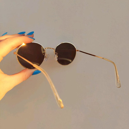 Sunglasses with blue mirror lenses and gold frame