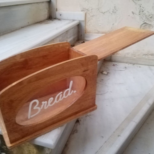 Wooden breadbox with hinged lid and metal handle used
